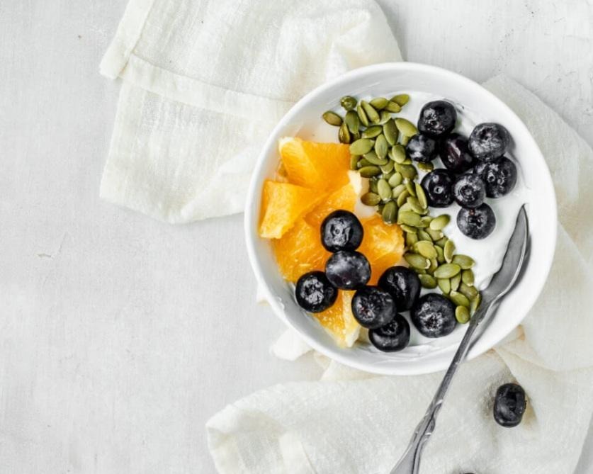 Breakfast recipes for longevity. Greek Yogurt with Orange, Blueberries & Pumpkin Seeds.